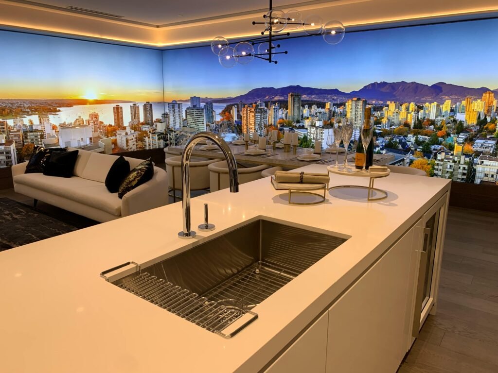 Modern kitchen interior with a cityscape backdrop featuring a vibrant skyline at sunset.