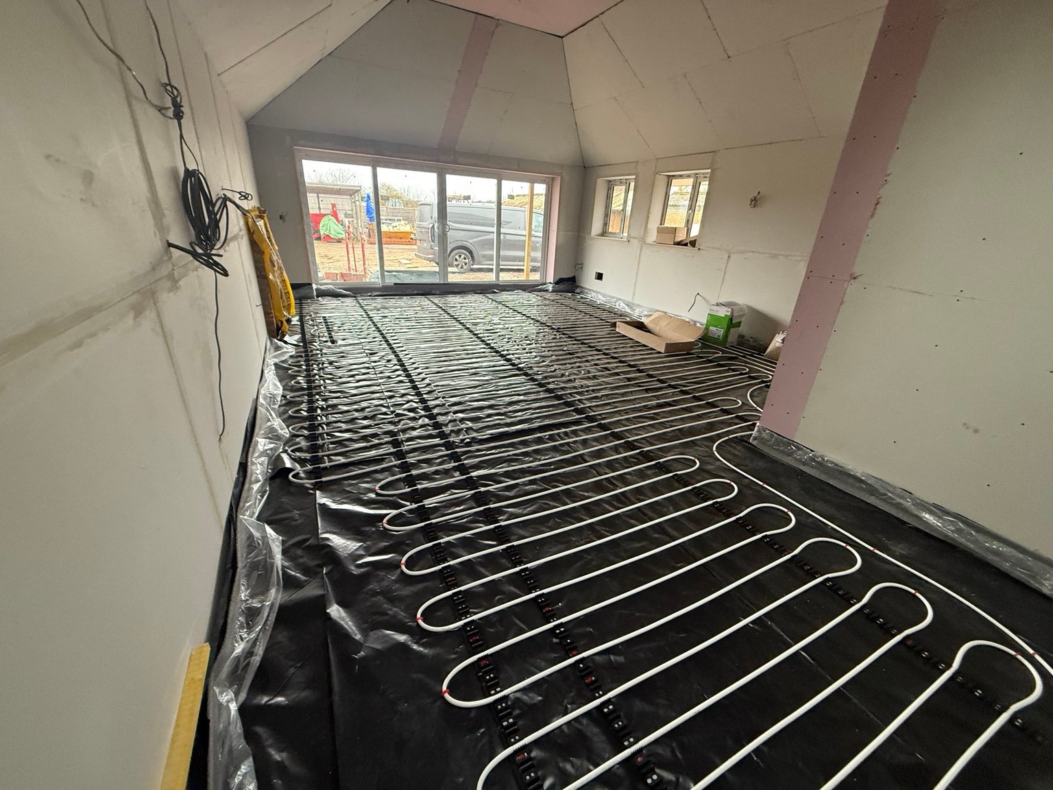 Wet underfloor heating pipework installation before floor covering