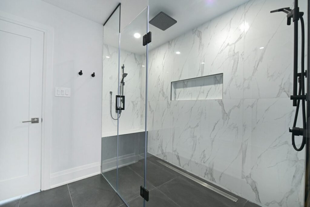 Contemporary walk-in shower illustrating shower and bathroom services